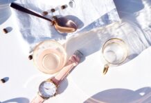 “피로·짜증·생리불순…혹시 식단 때문일까?” round gold-colored analog watch displaying 12:41 near cup of coffee