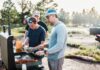 바쁜 일상 속 ‘마음 챙김 식사’ 실천법…행복한 식탁 만드는 작은 습관들 Three men cooking food on an outdoor grill.