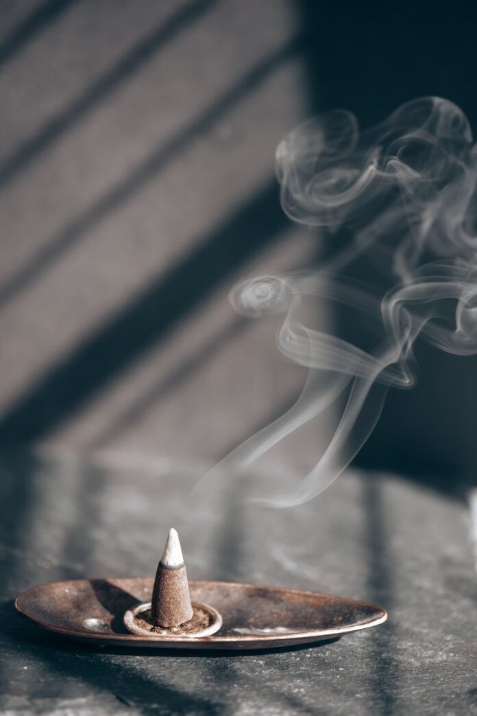 Photo by Ray Albrow white smoke on brown wooden table