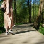 “마음 챙김 걷기, 일상에 녹여내는 새로운 건강 트렌드” woman walking on forest trail
